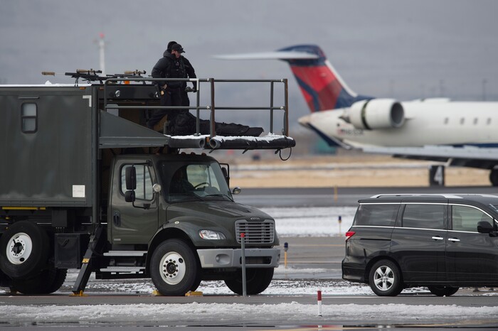 (Scott Sommerdorf   |  The Salt Lake Tribune)   Security personnel secure the runway as they wait for the arrival of Air Force One at the Ronald R Wright National Air Guard Base, Monday, December 4, 2017.  