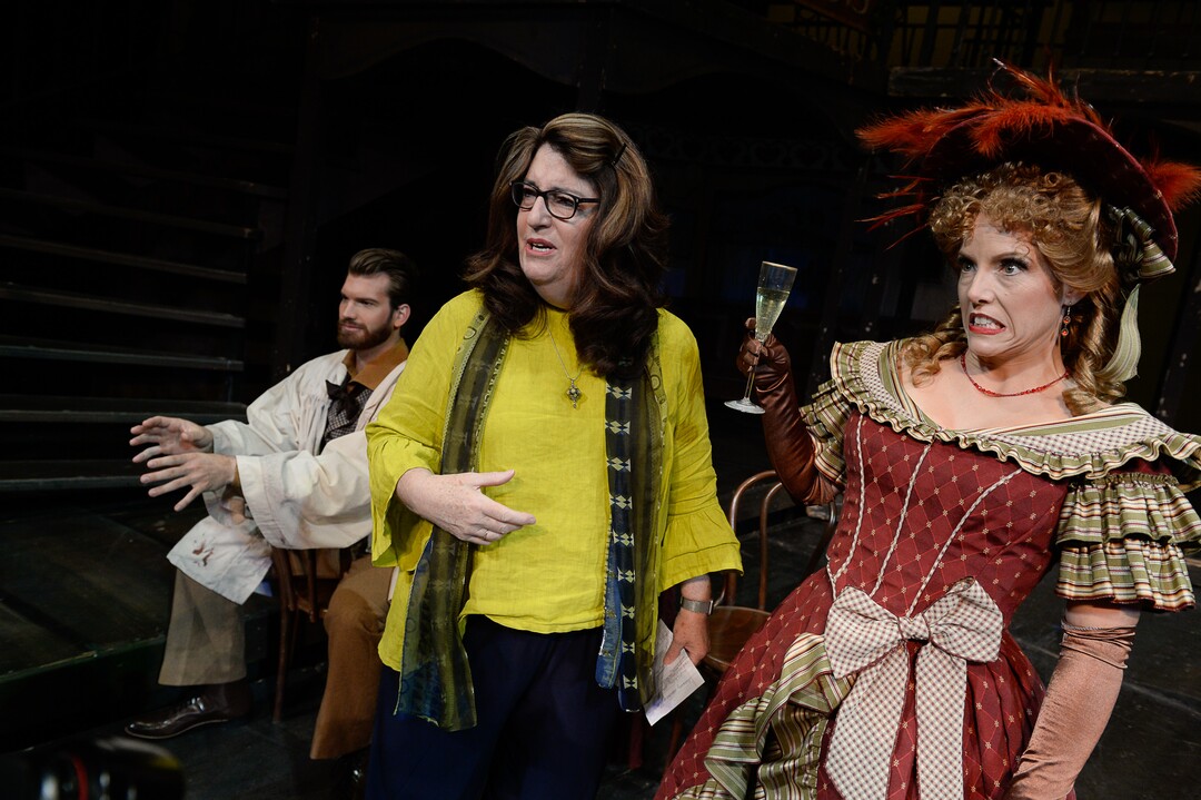 (Francisco Kjolseth  |  The Salt Lake Tribune)  Director Kathleen Clawson, center, sets up scenes for set photos as Celena Shafer (Musetta) makes a face when she asks if it's safe to take a sip of her drink as Utah Opera's season opener, "La bohème," Puccini's popular tearjerker about starving artists in turn-of-the-century Paris, opens for five shows on Oct. 7, 2017.