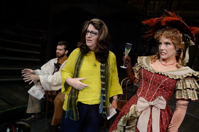 (Francisco Kjolseth  |  The Salt Lake Tribune)  Director Kathleen Clawson, center, sets up scenes for set photos as Celena Shafer (Musetta) makes a face when she asks if it's safe to take a sip of her drink as Utah Opera's season opener, "La bohème," Puccini's popular tearjerker about starving artists in turn-of-the-century Paris, opens for five shows on Oct. 7, 2017.
