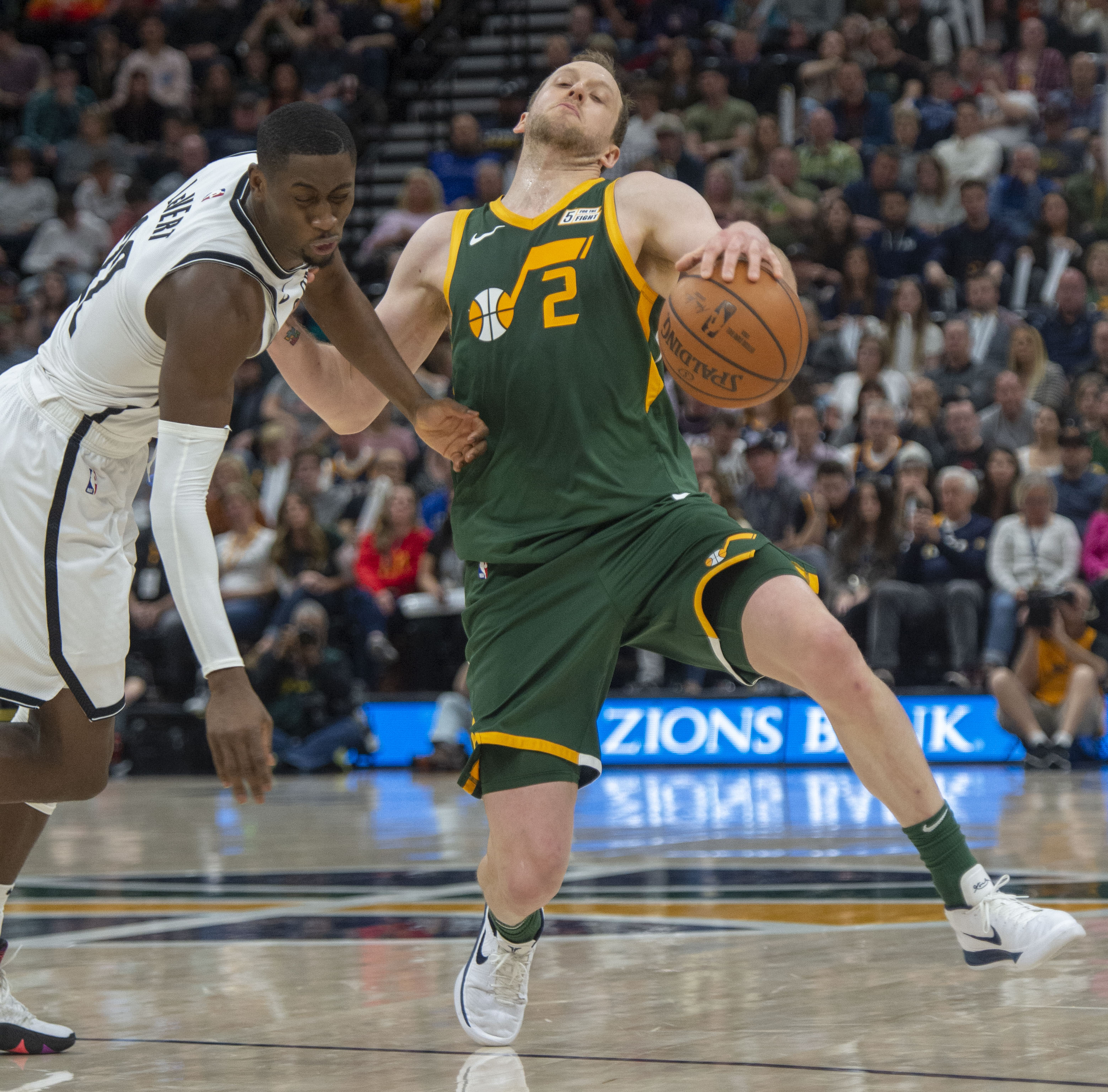 (Rick Egan  |  The Salt Lake Tribune)  Utah Utah Jazz forward Joe Ingles (2) gets called for an offensive foul as he comes in contact with Brooklyn Nets guard Caris LeVert (22), in  NBA action between Utah Jazz and Brooklyn Nets at Vivint Smart Home Arena, Saturday, March 17, 2019.


