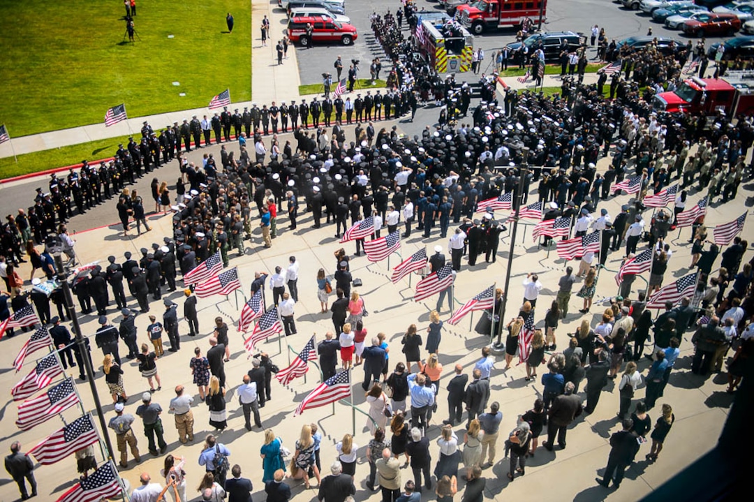 (Trent Nelson | The Salt Lake Tribune)  Funeral services for Battalion Chief Matthew Burchett at the Maverik Center in West Valley City, Monday Aug. 20, 2018.
