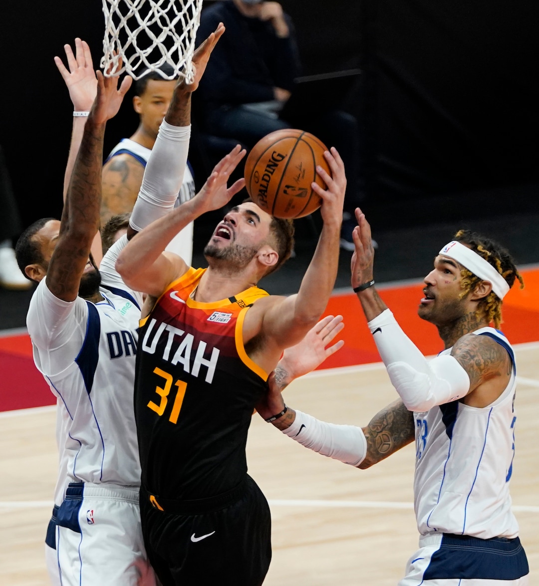 (Rick Egan | The Salt Lake Tribune)  Utah Jazz forward Georges Niang (31) goes up for a shot as Dallas Mavericks forward James Johnson (16) defends, in NBA action between the Utah Jazz and the Dallas Mavericks at Vivint Arena, on Friday, Jan. 29, 2021.