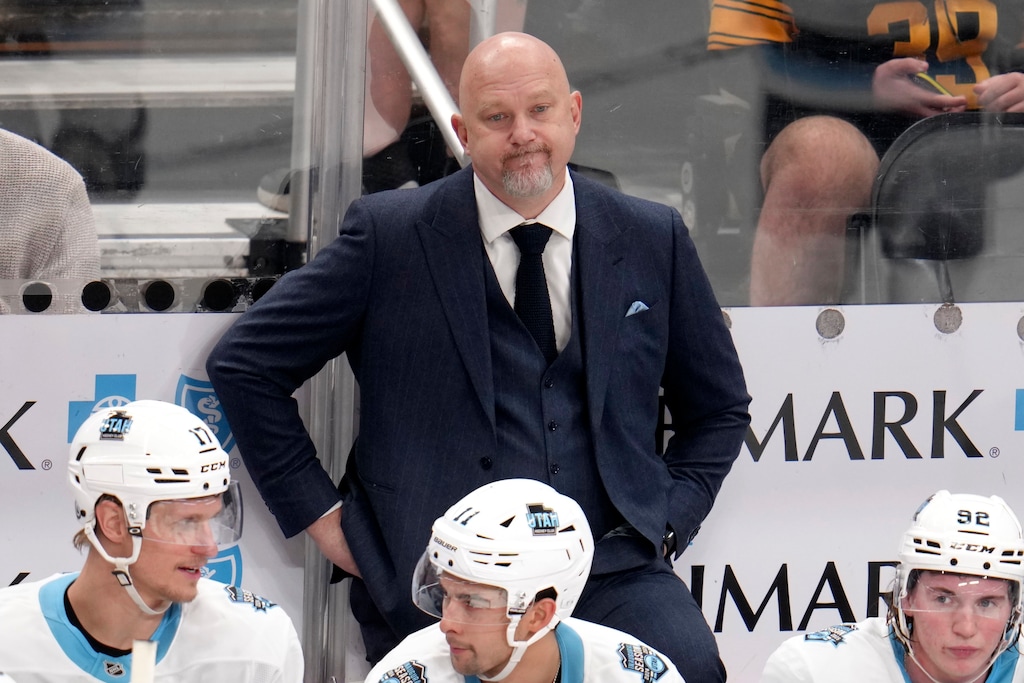 (Gene J. Puskar | AP) Utah Hockey Club head coach Andre Tourigny stands behind his bench during the third period of an NHL hockey game against the Pittsburgh Penguins, Saturday, Nov. 23, 2024, in Pittsburgh. 