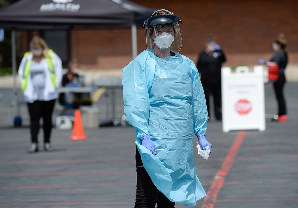 (Francisco Kjolseth  | Tribune file photo) In this May 6, 2020, file photo, certified medical assistant Shelby Close, waits for people to be tested for COVID-19, followed by a blood draw to test for coronavirus antibodies in Park City. The pandemic has, as yet, not had a major effect on health insurance premiums going into the new year.