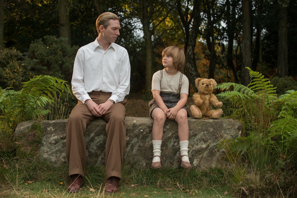 (David Appleby | Fox Searchlight Pictures) Author A.A. Milne (Domhnall Gleeson, left) finds inspiration from his son, Christopher Robin (Will Tilston) and his toys, in the drama "Goodbye Christopher Robin).