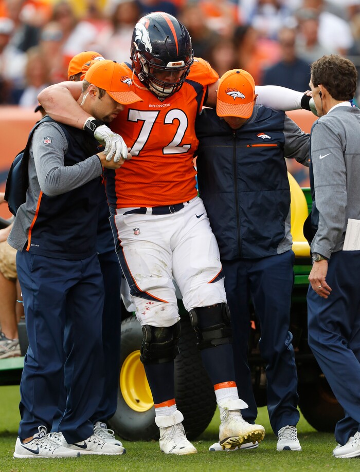 Denver Broncos offensive tackle Garett Bolles (72) is helped after an injury against the Dallas Cowboys during the second half of an NFL football game, Sunday, Sept. 17, 2017, in Denver. (AP Photo/Joe Mahoney)