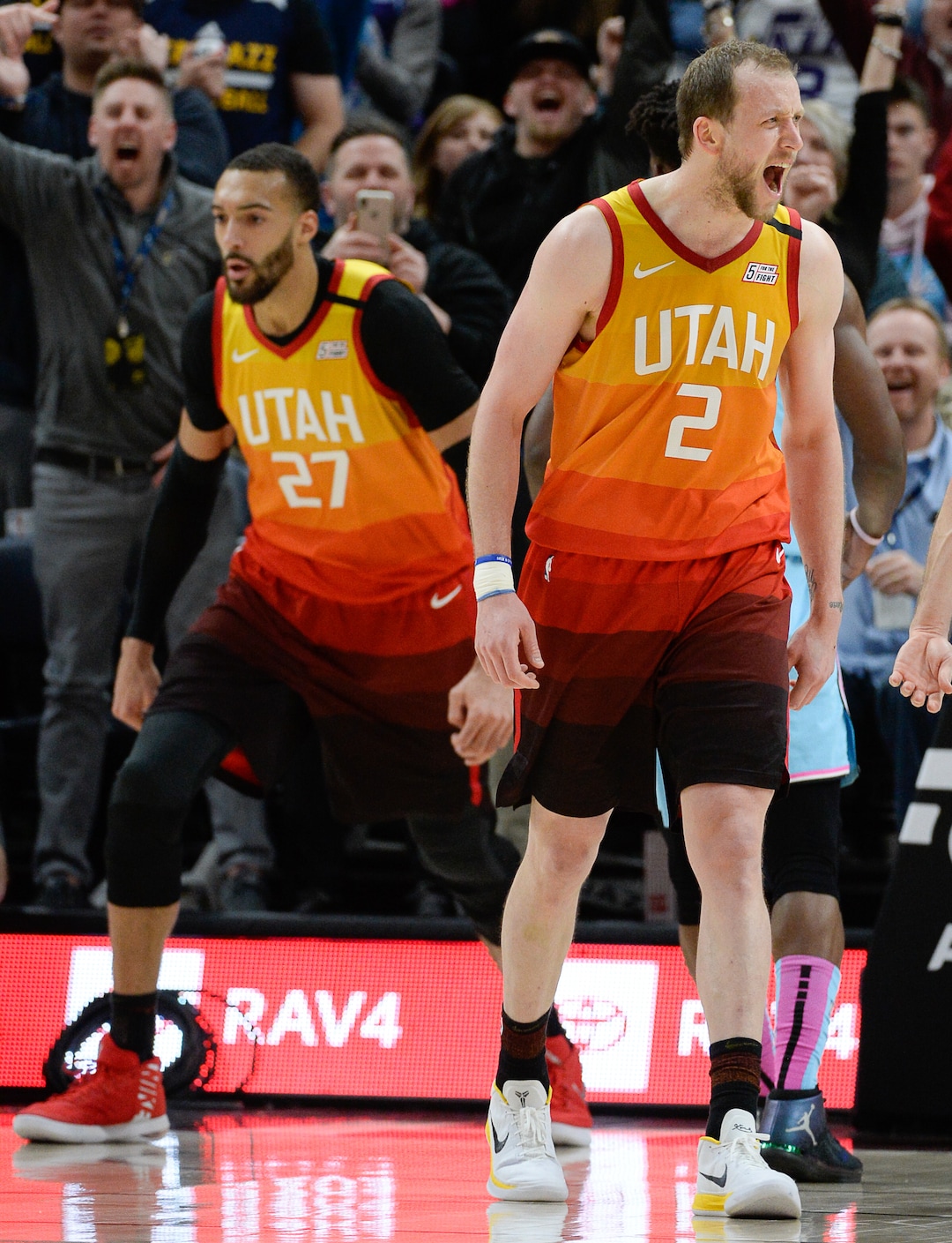 (Francisco Kjolseth  |  The Salt Lake Tribune) Utah Jazz center Rudy Gobert (27) gets an assist from Utah Jazz guard Joe Ingles (2) for a dunk in the final minutes as the Utah Jazz host the Miami Heat in their NBA basketball game at Vivint Smart Home Arena in Salt Lake City on Wednesday, Feb. 12, 2020. The Jazz won 116-101.