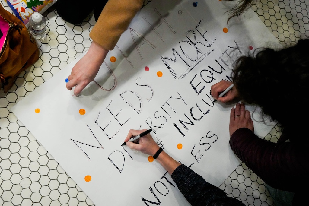 (Francisco Kjolseth | The Salt Lake Tribune) Hands come together to support a silent rally at the Utah Capitol before the Senate Education Committee hears HB261, the anti-DEI bill that would dismantle diversity offices in Utah public education and government, on Monday, Jan. 22, 2024.