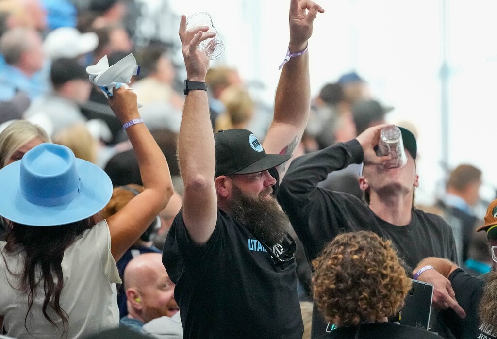 (Francisco Kjolseth  | The Salt Lake Tribune) Hockey fans down a record number of beers during Utah’s inaugural NHL season kick off game at the Delta Center against the Chicago Blackhawks in Salt Lake City on Tuesday, October. 8, 2024.