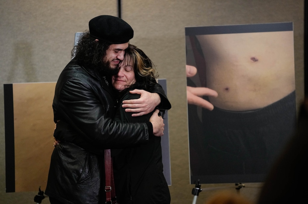 (Francisco Kjolseth | The Salt Lake Tribune) Arturo Gamboa, who was arrested after being shot at a “No Kings” march in Salt Lake City in June, is embraced by his mother following a news conference on Tuesday, Dec. 9, 2025. Gamboa was arrested the night of the shooting but was later released after investigators determined he never fired his weapon.