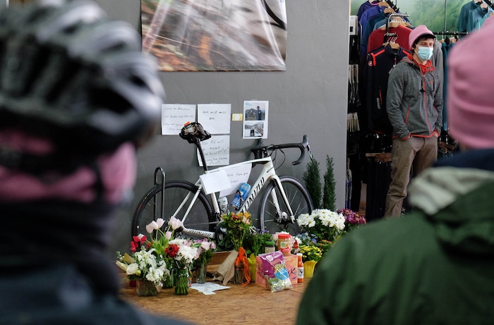 (Francisco Kjolseth  | The Salt Lake Tribune) People gather in a big circle at Hangar 15 bicycle shop in Millcreek to tell stories of Louis Holian, Sarah Moughamian and Thomas Steinbrecher on Sunday, Feb. 14, 2021, three of the four who died in an avalanche on Saturday, Feb. 6. Stephanie Hopkins who was in a different group that day was swept up in the same avalanche.