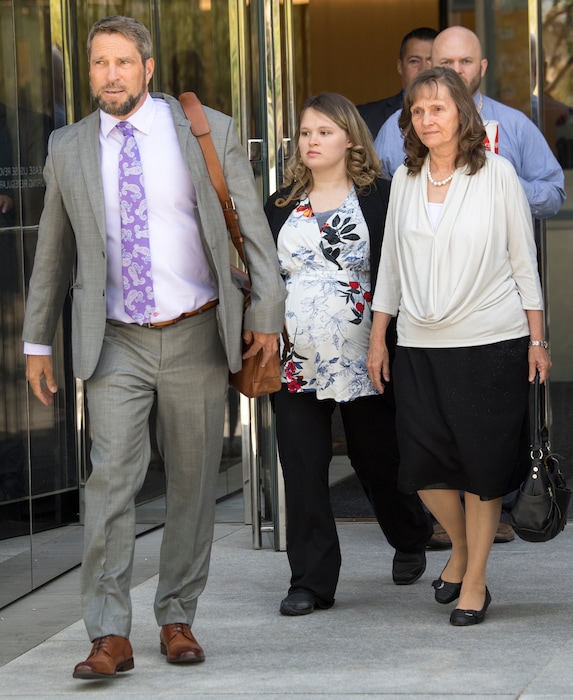 (Rick Egan  |  The Salt Lake Tribune)     Attorney Scott C. Williams leaves the federal courthouse along with Carrie Kingston, wife of Isaiah Kingston, and Isaiah's mother, Rachel Ann Kingston, after a hearing for defendants, Jacob and Isaiah Kingston Wednesday, Aug. 29, 2018.