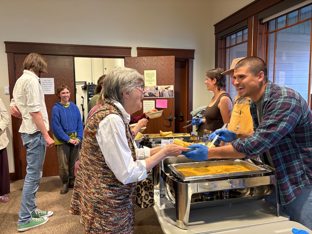 (Brooke Larsen | The Salt Lake Tribune) Jordan Hebner, a co-founder of the Rockville Supper Club, serves attendees of a fundraiser dinner for immigrant families at the Springdale Community Center on Tuesday, March 10, 2026.
