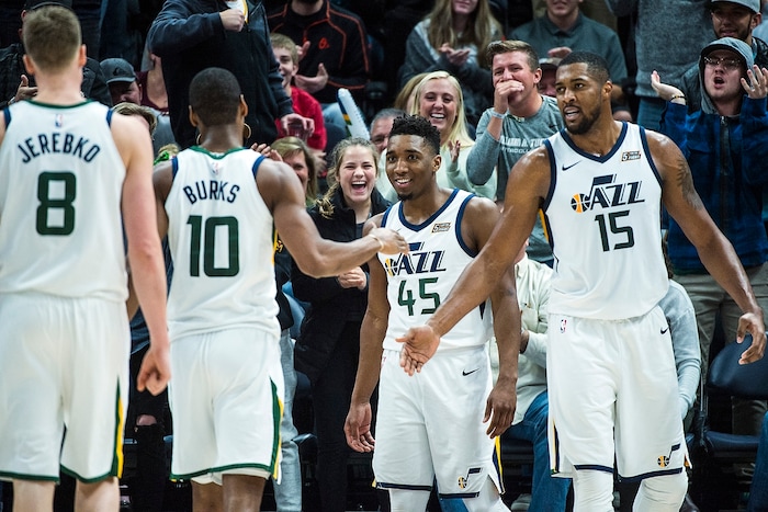 (Chris Detrick  |  The Salt Lake Tribune)  Utah Jazz guard Donovan Mitchell (45) celebrates with Utah Jazz guard Alec Burks (10) and Utah Jazz forward Derrick Favors (15) during the game at Vivint Smart Home Arena Friday, December 1, 2017.  Utah Jazz defeated New Orleans Pelicans 114-108.