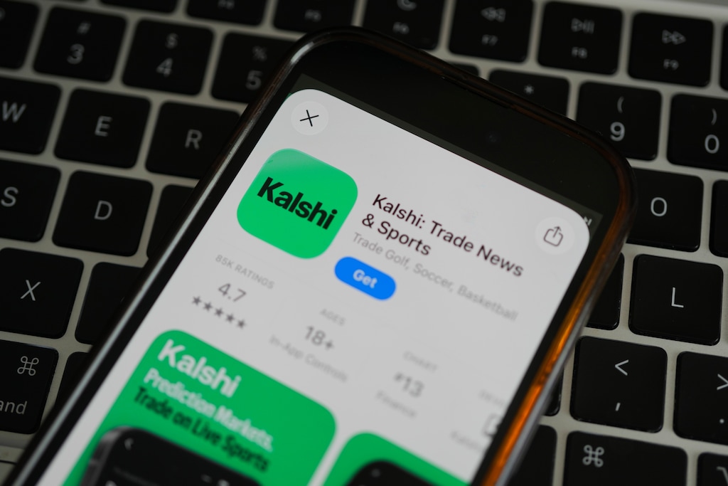 (Erin Hooley | AP) An ad for the prediction market app Kalshi is displayed on a mobile phone Thursday, April 16, 2026, in Chicago.