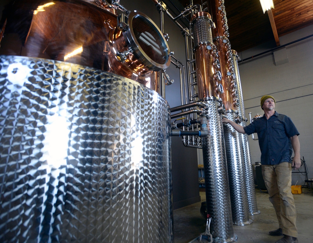 (Al Hartmann  |  The Salt Lake Tribune) 	
Head distiller Chris Barlow gets the new 450-gallon copper still up and running at Beehive Distilling's new Salt Lake City location, 2245 S. West Temple. Beehive will continue to make its signature Jack Rabbit gin, but the larger still means it can start producing whiskey and other spirits.
