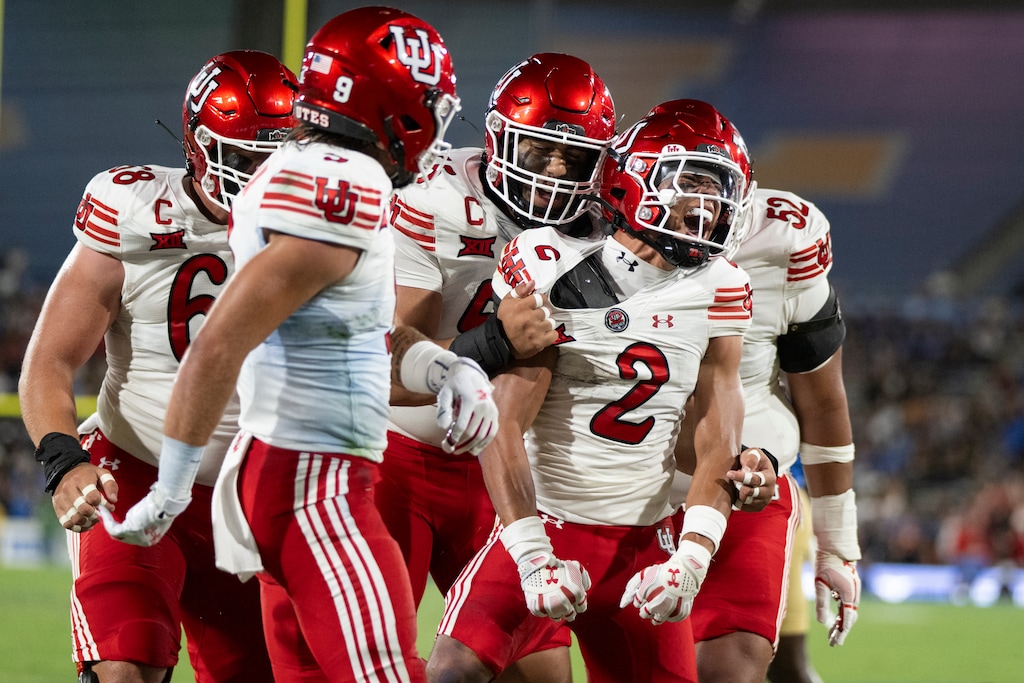 Utah players celebrate a touchdown by cornerback Smith Snowden during an NCAA football game against the UCLA on Saturday, Aug. 30, 2025, in Pasadena, Calif. (AP Photo/Kyusung Gong)