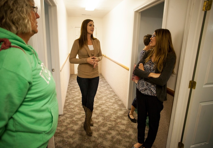In this April 30, 2018, photo, Jena Jones, Director of the Short Creek Dream Center, guides a tour through the renovated facility, formally the home of polygamous sect leader Warren Jeffs in Hildale, Utah. The sprawling house surrounded by towering brick walls has been converted into a sober living center by Evangelical missionaries, the latest sign of the group’s dwindling control of the small community on the Utah-Arizona border. (Chris Caldwell/The Spectrum via AP)
