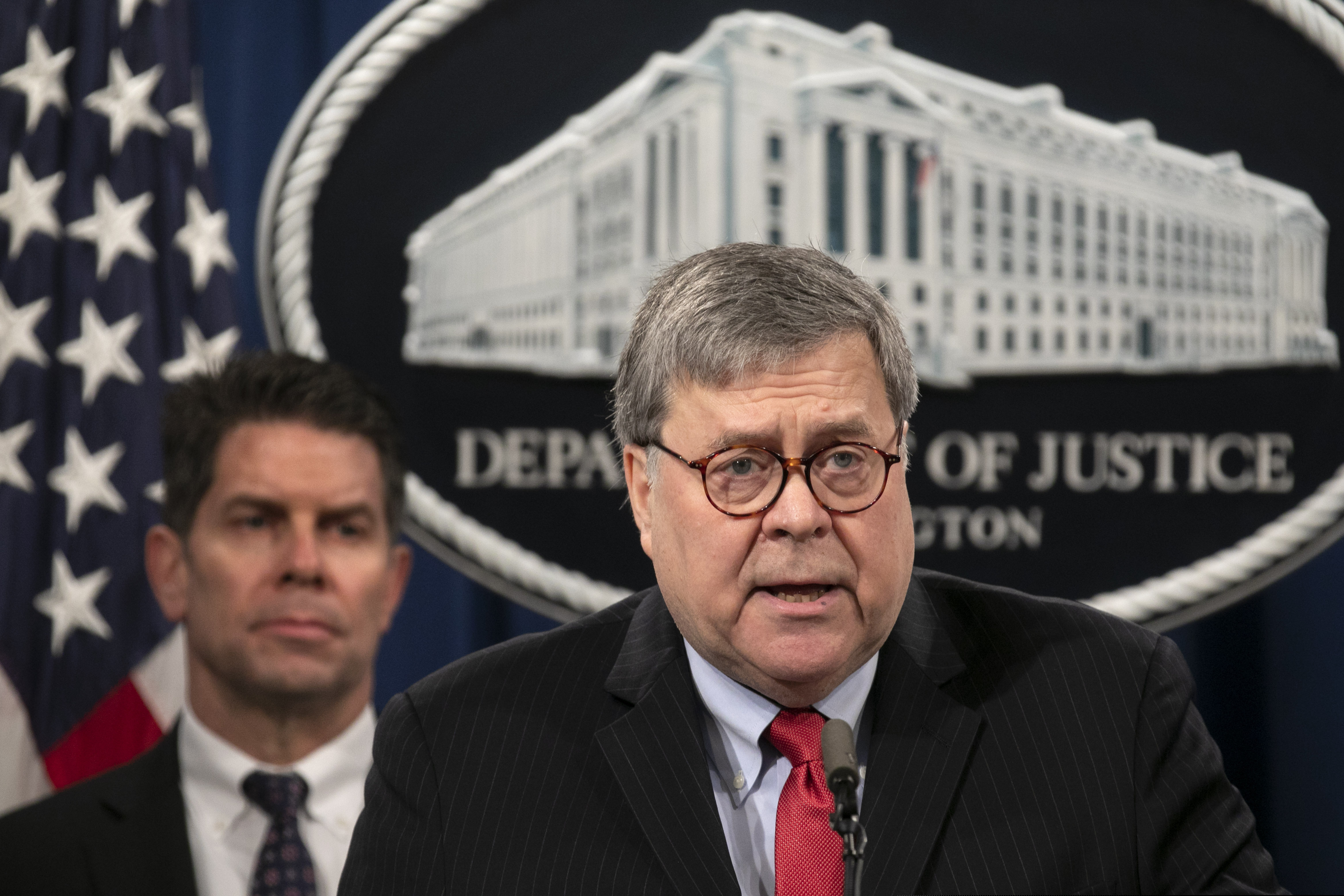 (Jacquelyn Martin | AP) Attorney General William Barr, right, next to FBI Deputy Director David Bowdich, speaks during a news conference, Monday, Feb. 10, 2020, at the Justice Department in Washington.