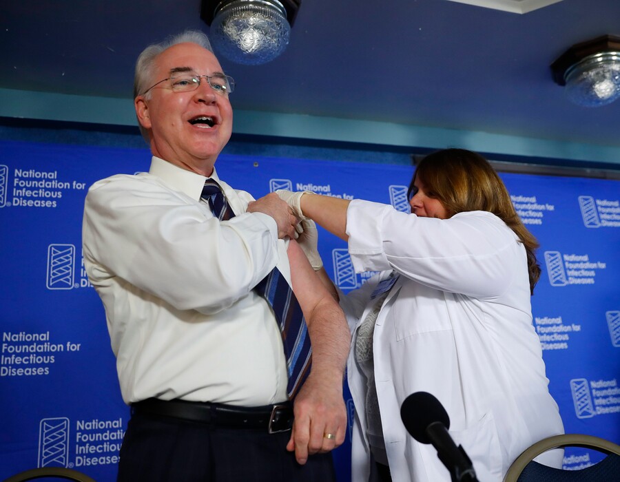 Health and Human Services Secretary Tom Price, left, receives a flu vaccination from Sharon Walsh-Bonadies, RN., right during a news conference recommending everyone age six months an older be vaccinated against influenza each year, Thursday, Sept. 28, 2017 in Washington. (AP Photo/Pablo Martinez Monsivais)