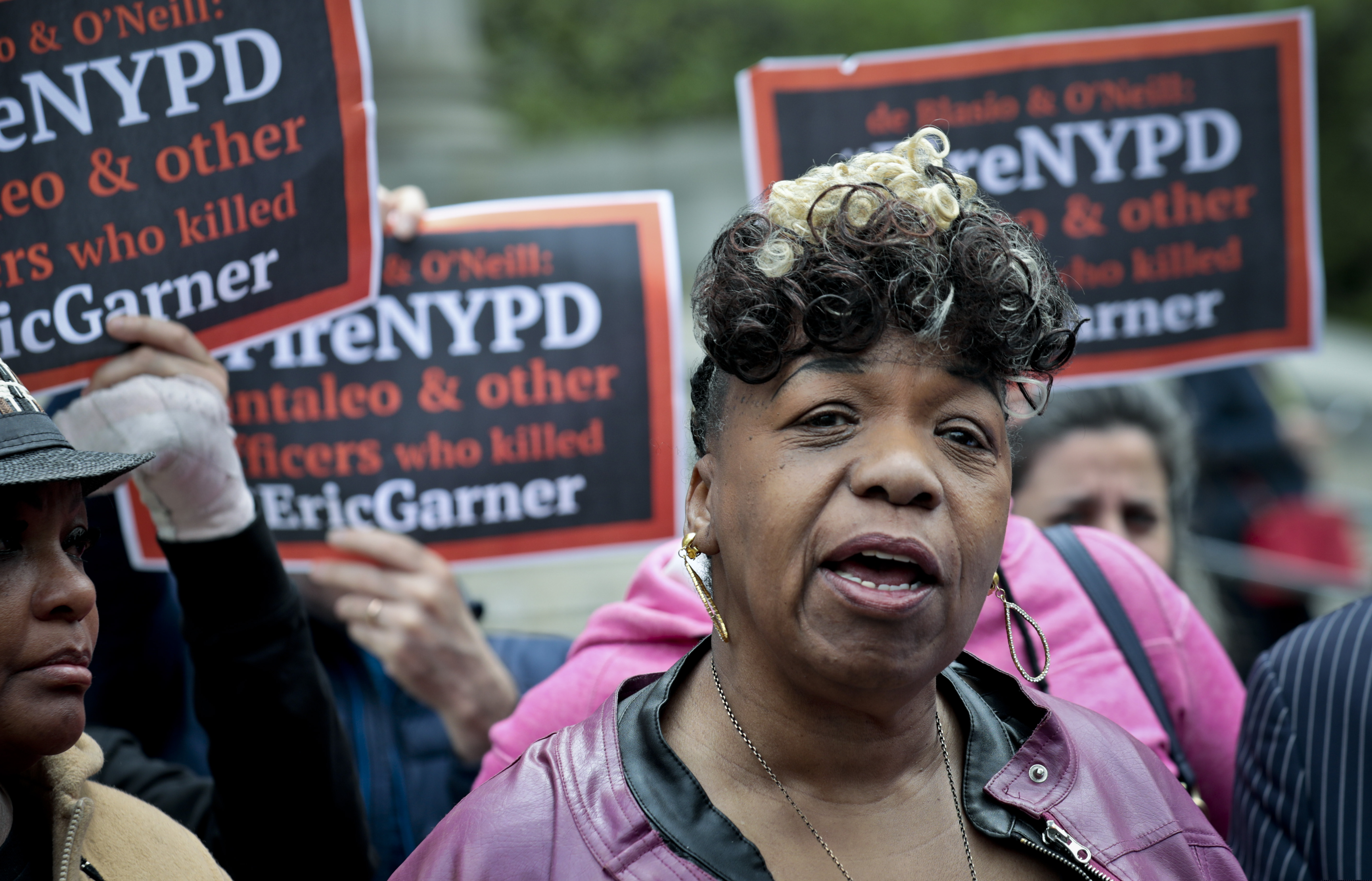 In this Thursday May 9, 2019 photo, Gwen Carr, left, mother of Eric Garner- an unarmed black man who died as he was being subdued in a chokehold by police officer Daniel Pantaleo nearly five years ago, speak during a press conference after leaving court in New York. A judge cleared the way for a police disciplinary trial to begin next week for Pantaleo in the death of Garner, after rejecting his claim that a police watchdog agency didn't have jurisdiction to prosecute the case. (AP Photo/Bebeto Matthews)