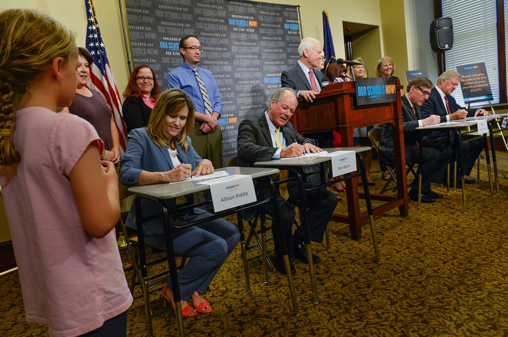 (Francisco Kjolseth | Tribune file photo) Using school desks as props, and surrounded by teachers of the year and Alpine School District students, Our Schools Now formally launch its tax increase initiative during a press event at the Capitol on Tuesday, June 6, 2017.