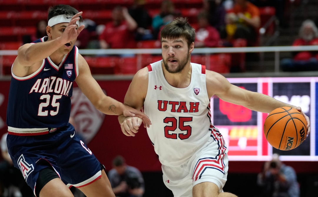 (Francisco Kjolseth | The Salt Lake Tribune) Utah Utes guard Rollie Worster (25) drives the ball past Arizona Wildcats guard Kerr Kriisa (25) as the University of Utah hosts the Arizona Wildcats in NCAA basketball in Salt Lake City on Thursday, Dec. 1, 2022.