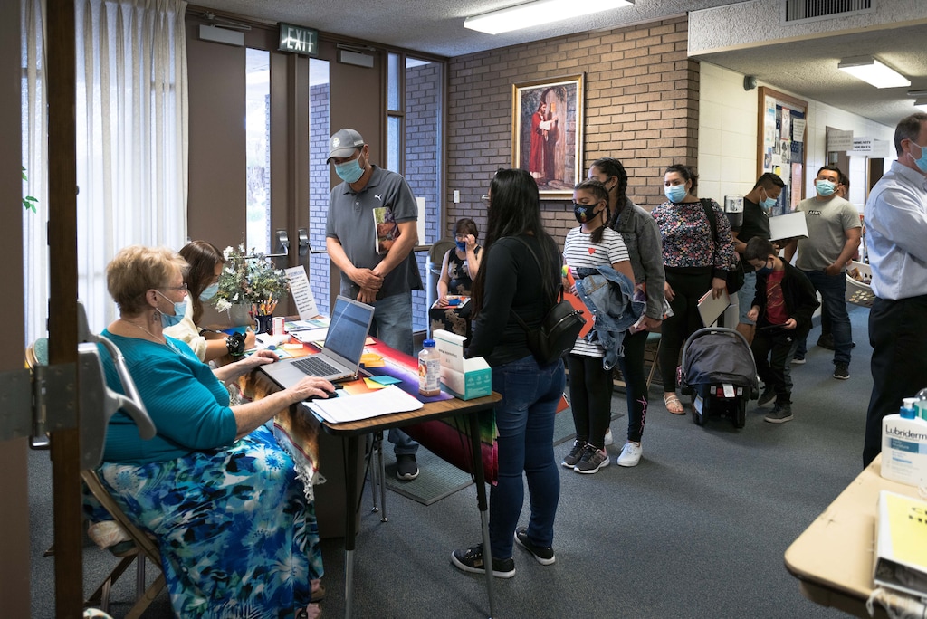 (The Church of Jesus Christ of Latter-day Saints)
Volunteers check in dozens and dozens of immigrants at a Las Vegas Welcome Center in Las Vegas on April 27, 2021.