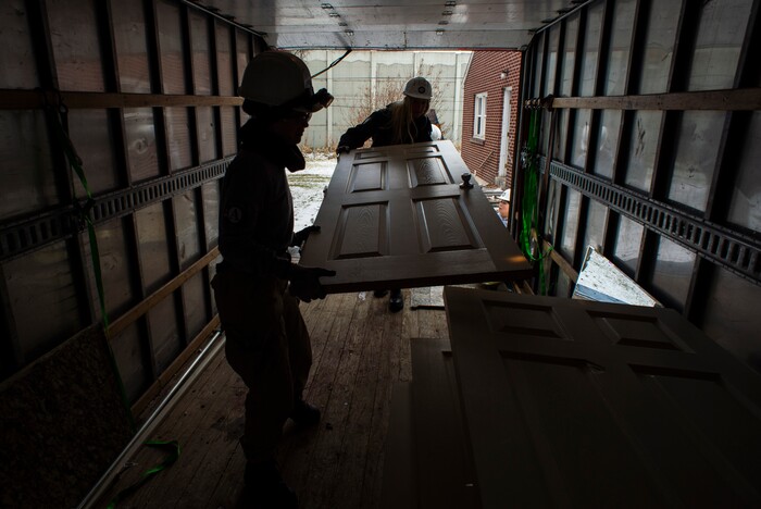 (Rick Egan  |  The Salt Lake Tribune)       Tierra Pouttu-Clarke and Taylor Drake from AmeriCorps, removes a closet door from a home that will be demolished for freeway widening, for UDOT and Habitat for Humanity, Wednesday, Jan. 16, 2019.





