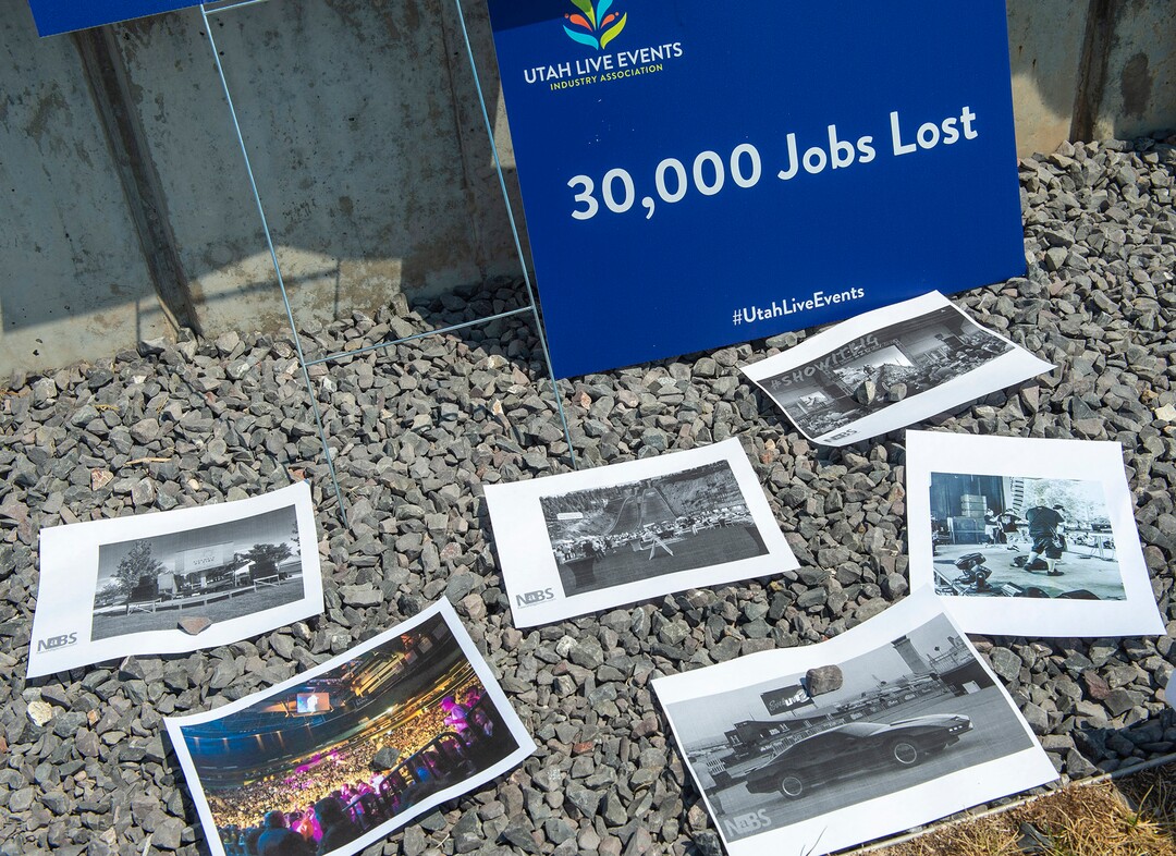 (Rick Egan  |  The Salt Lake Tribune)     Organizer, Peter O'Doherty, puts photos of live events on the grass as members of Utah Live Events Industry Association at a rally at the State Capitol to call attention to the state of their industry, on Tuesday, July 21, 2020.
