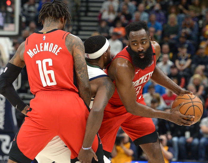 (Leah Hogsten  |  The Salt Lake Tribune)  Utah Jazz forward Royce O'Neale (23) is sandwiched between Houston Rockets guard Ben McLemore (16) and Houston Rockets guard James Harden (13). The Utah Jazz lost to the Houston Rockets 110-120 at Vivint Arena, Feb. 22, 2020.