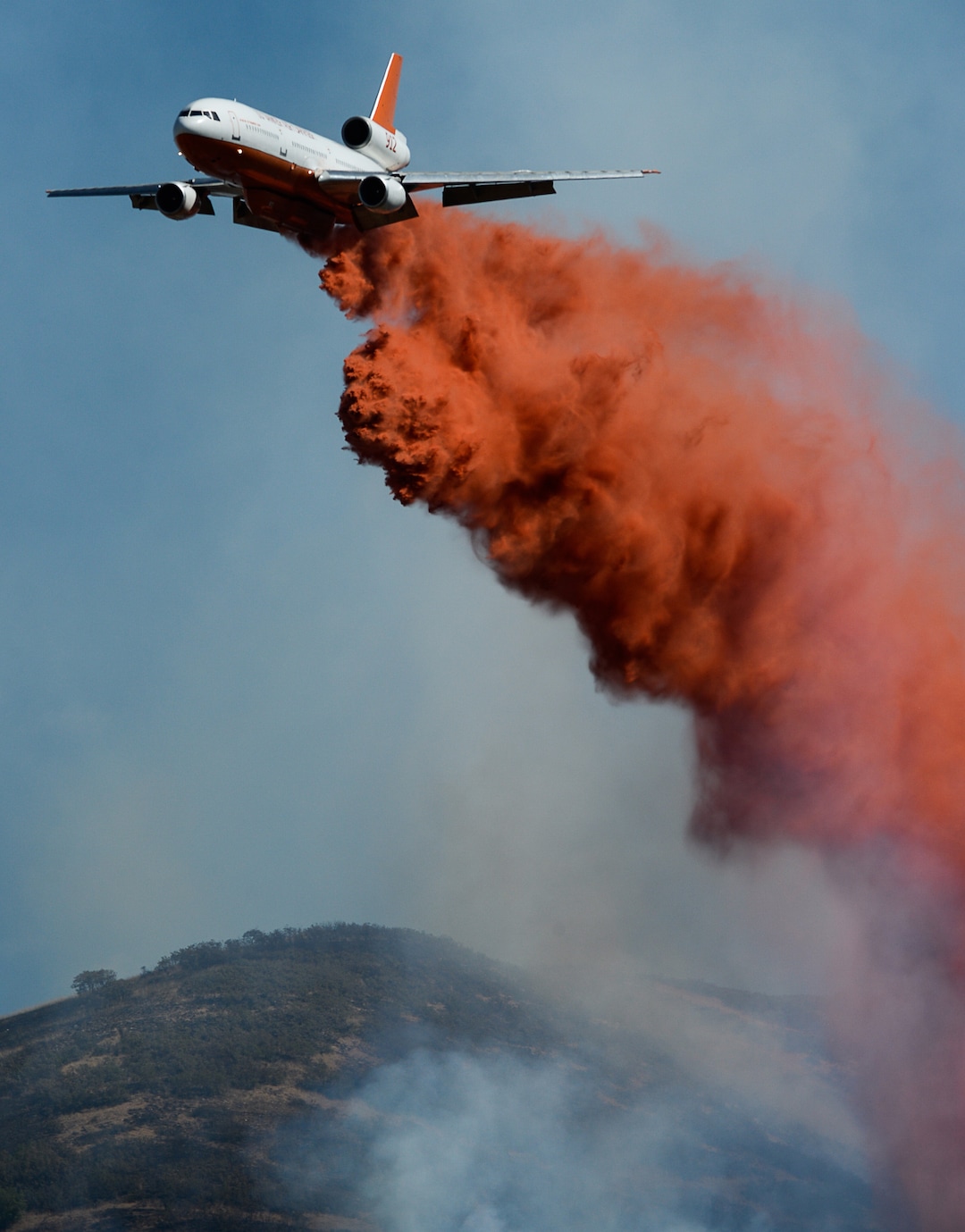 (Francisco Kjolseth  |  The Salt Lake Tribune)  Fire Crews direct a slurry bomber to unload its payload along the East Bountiful bench that grew to 150 acres early Friday morning, Aug. 30, 2019, and destroyed three homes. On Sept. 2, officials said the fire was 100% contained.
