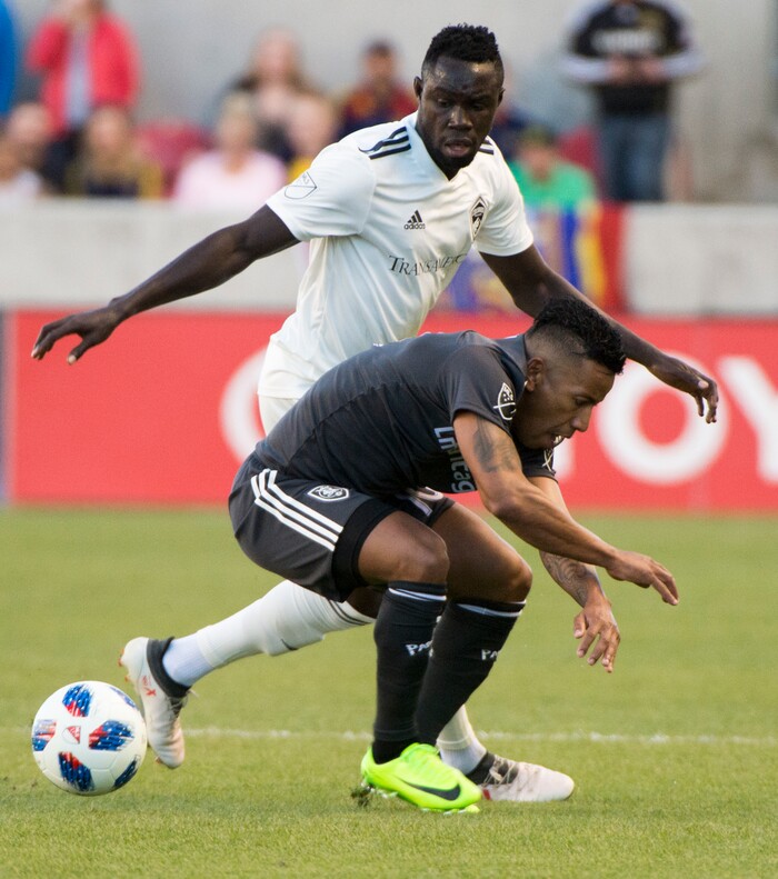 (Rick Egan  |  The Salt Lake Tribune)    Real Salt Lake forward Joao Plata (10) collides with Colorado Rapids defender Bismark Adjei-Boateng (21), as he goes for the ball, in MLS soccer action, RSL vs Colorado Rapids at Rio Tinto Stadium, Saturday, April 21, 2018.


