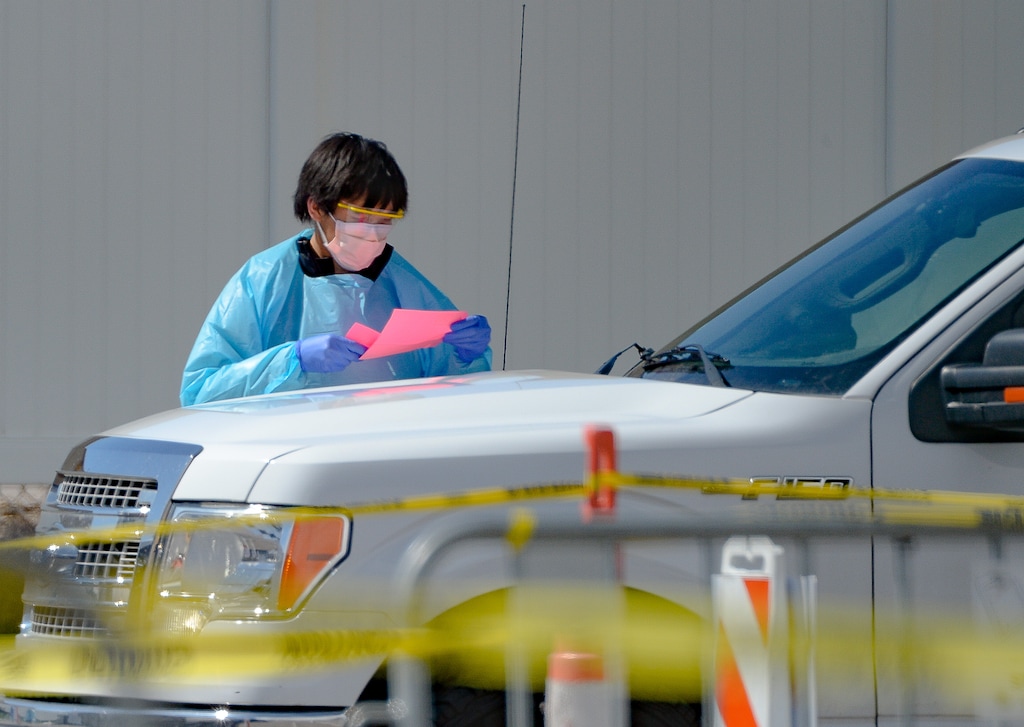 (Francisco Kjolseth  |  The Salt Lake Tribune) Medical workers provide drive-thru COVID-19 testing at University of Utah Health’s Redwood Health Center in Salt Lake City on Friday, March 27, 2020.