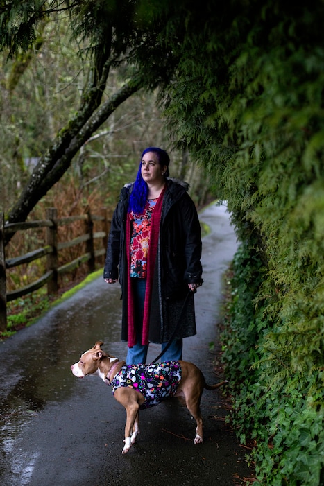 Emily James, who was fired from her job at a call center for U.S. Bank after giving 20 dollars of her own money to a customer on Christmas Eve, with Harley Quinn, an emotional support dog, in Portland, Ore., on Jan. 29, 2020. "U.S. Bank shows what it means when it says its employees should 'do the right thing,'" writes Nicholas Kristof. (Alisha Jucevic/The New York Times)