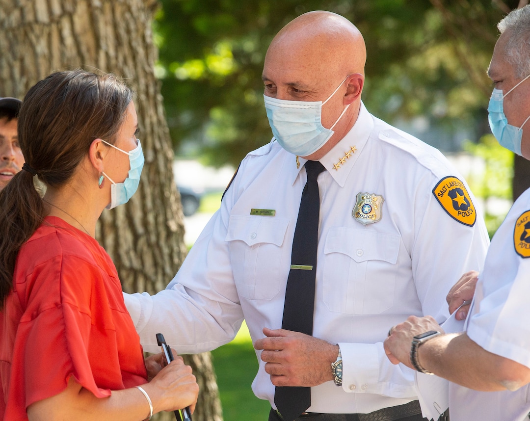 (Rick Egan  |  The Salt Lake Tribune)     Salt Lake City Mayor Erin Mendenhall talks with Salt Lake City Police Chief Mike Brown after announcing updates to SLCPD policies, during news conference at City Hall, Monday, Aug. 3, 2020.