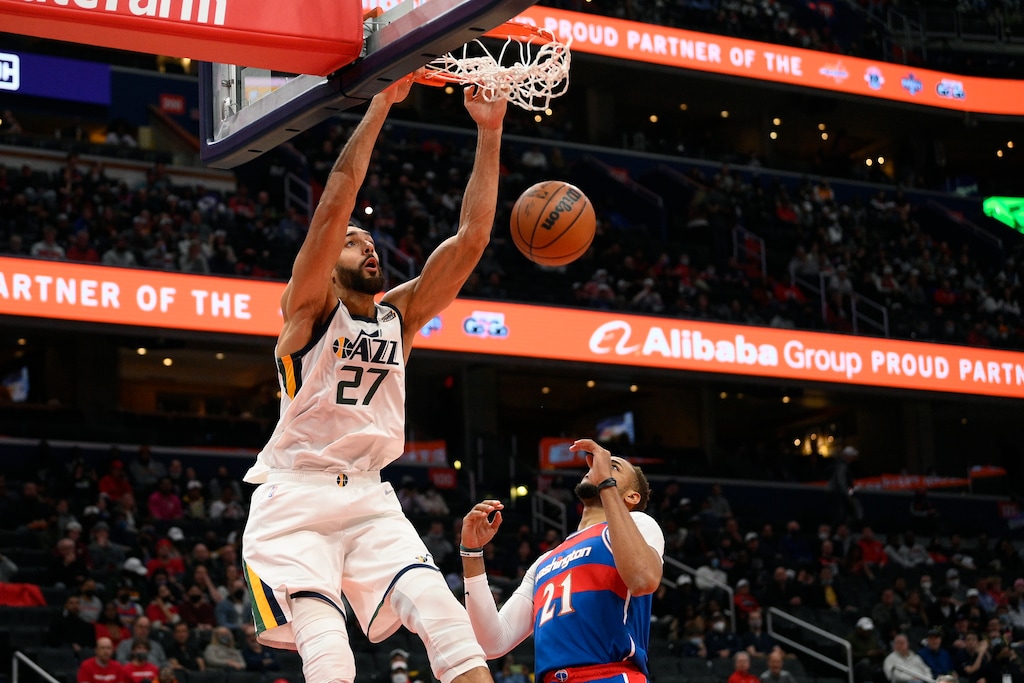 Utah Jazz center Rudy Gobert (27) dunks over Washington Wizards center Daniel Gafford (21) during the first half of an NBA basketball game Saturday, Dec. 11, 2021, in Washington. (AP Photo/Nick Wass)