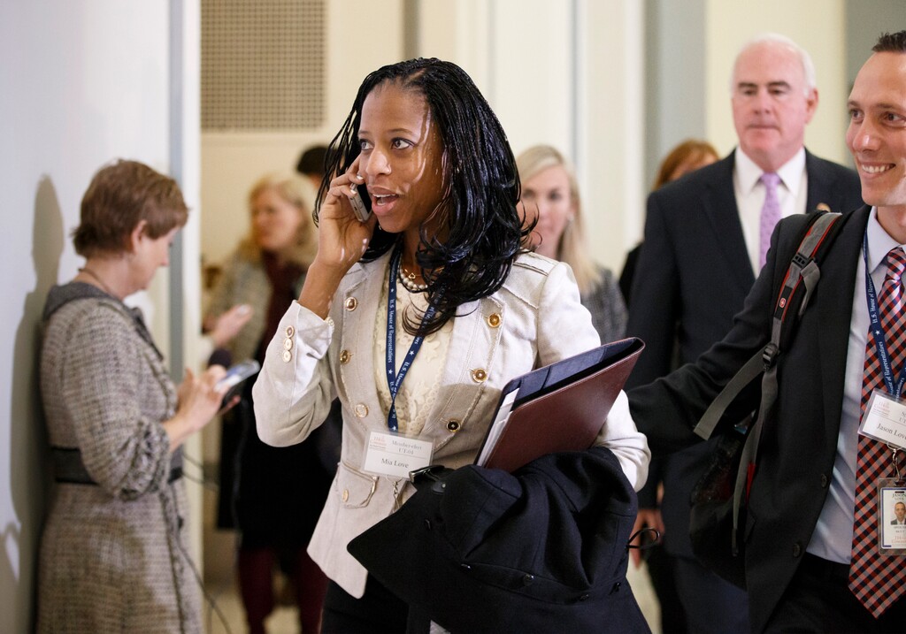 Rep.-elect Mia Love, R-Utah, arrives with her husband Jason Love, right, on Capitol Hill in Washington, Thursday, Nov. 13, 2014, as House Republicans arrive to choose their leadership for the 114th Congress that convenes in January.  (AP Photo/J. Scott Applewhite)