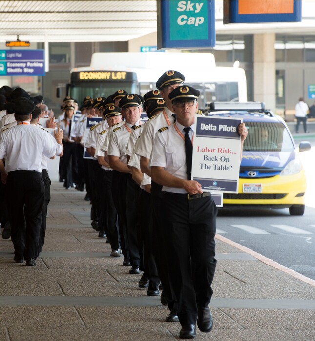 (Steve Griffin | Tribune file photo)

In this file photo from June 24, 2016, about 90 Delta Air Lines pilots participate in a national picket to protest salaries at the Salt Lake City International Airport. Utah has one of the nation's lowest rates of union participation.