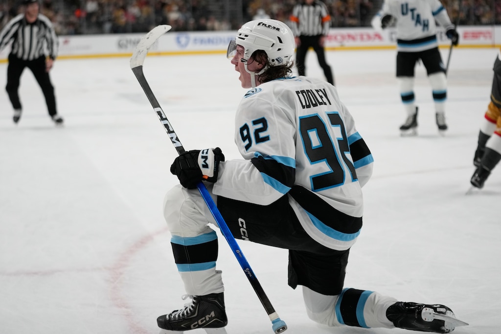(John Locher | AP) Utah Mammoth center Logan Cooley (92) celebrates after scoring against the Vegas Golden Knights during the first period in Game 1 on Sunday.