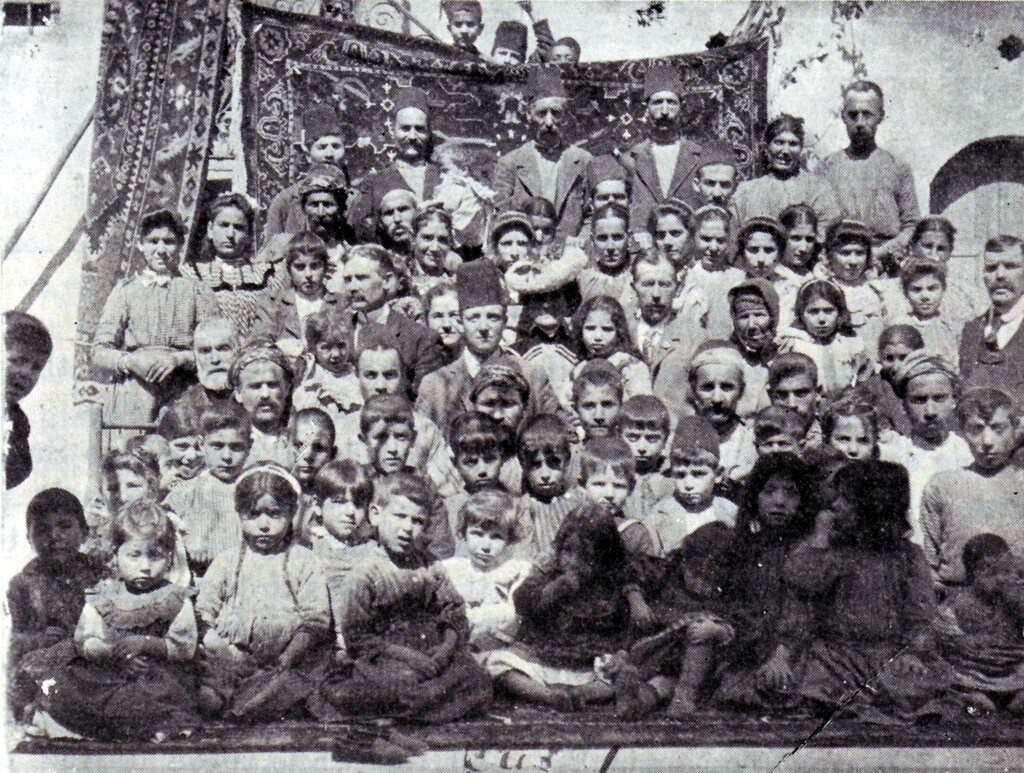 (Church archives)
Turkey's Aintab Sunday school, circa 1904, published in the Juvenile Instructor May, 15, 1905. Joseph Wilford Booth is standing on the right edge, wearing a suit and tie. His wife, Reba, is in the center, wearing a flowery American hat.