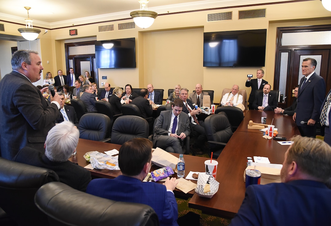 (Francisco Kjolseth  |  The Salt Lake Tribune)  Rep. Lee Perry, R-Perry, left, asks Sen. Mitt Romney about efforts to schedule marijuana as a class 2 drug during a meeting with  members of the Republican House Caucus at the Utah Capitol on Thursday, Feb. 21, 2019.