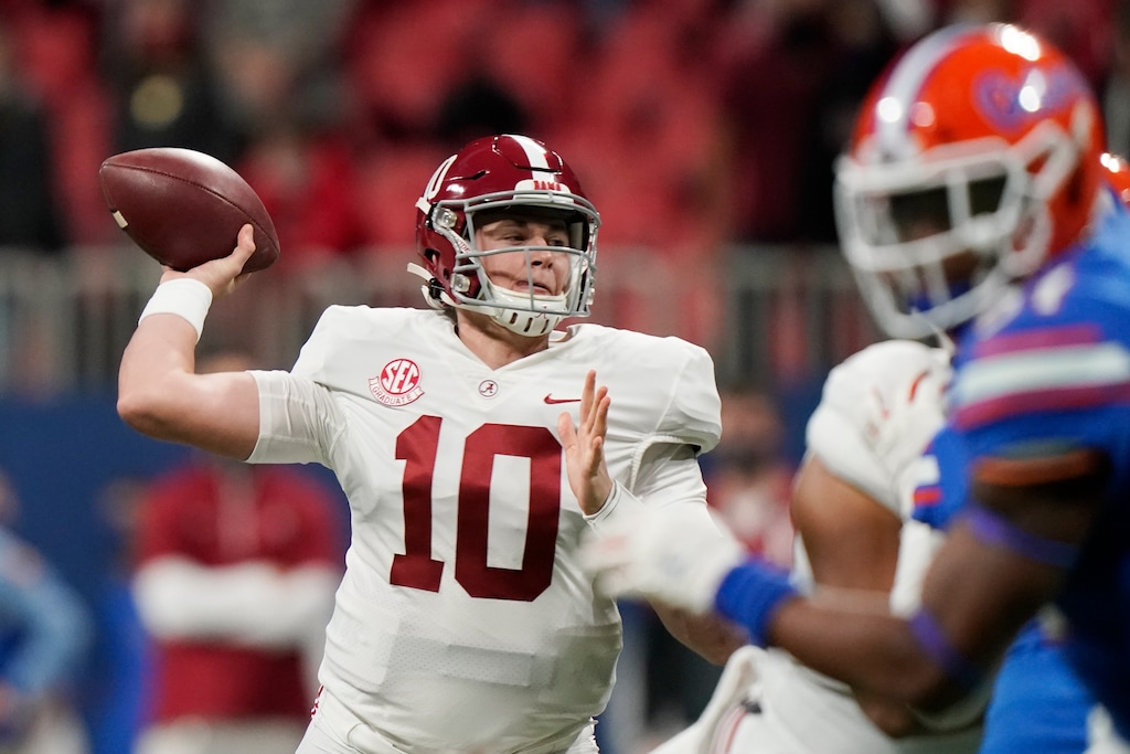 FILE - In this Saturday, Dec. 19, 2020, file photo, Alabama quarterback Mac Jones (10) throws a pass against Florida during the first half of the Southeastern Conference championship NCAA college football game in Atlanta. Jones has been named a finalist for the Heisman Trophy. The Heisman will be awarded Jan. 5 during a virtual ceremony as the pandemic forced the cancellation of the usual trip to New York that for the presentation that usually comes with being a finalist. (AP Photo/Brynn Anderson, File)