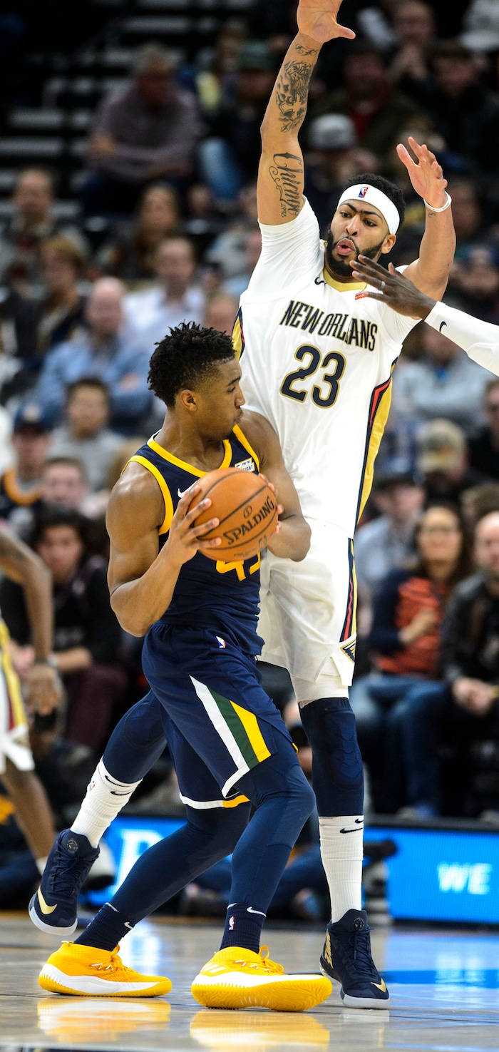 (Steve Griffin  |  The Salt Lake Tribune) Utah Jazz guard Donovan Mitchell (45) is forced to pass as New Orleans Pelicans forward Anthony Davis (23) defends him during the the Utah Jazz versus the New Orleans Pelicans NBA basketball game at the Vivint Smart Home Arena in Salt Lake City Wednesday January 3, 2018.