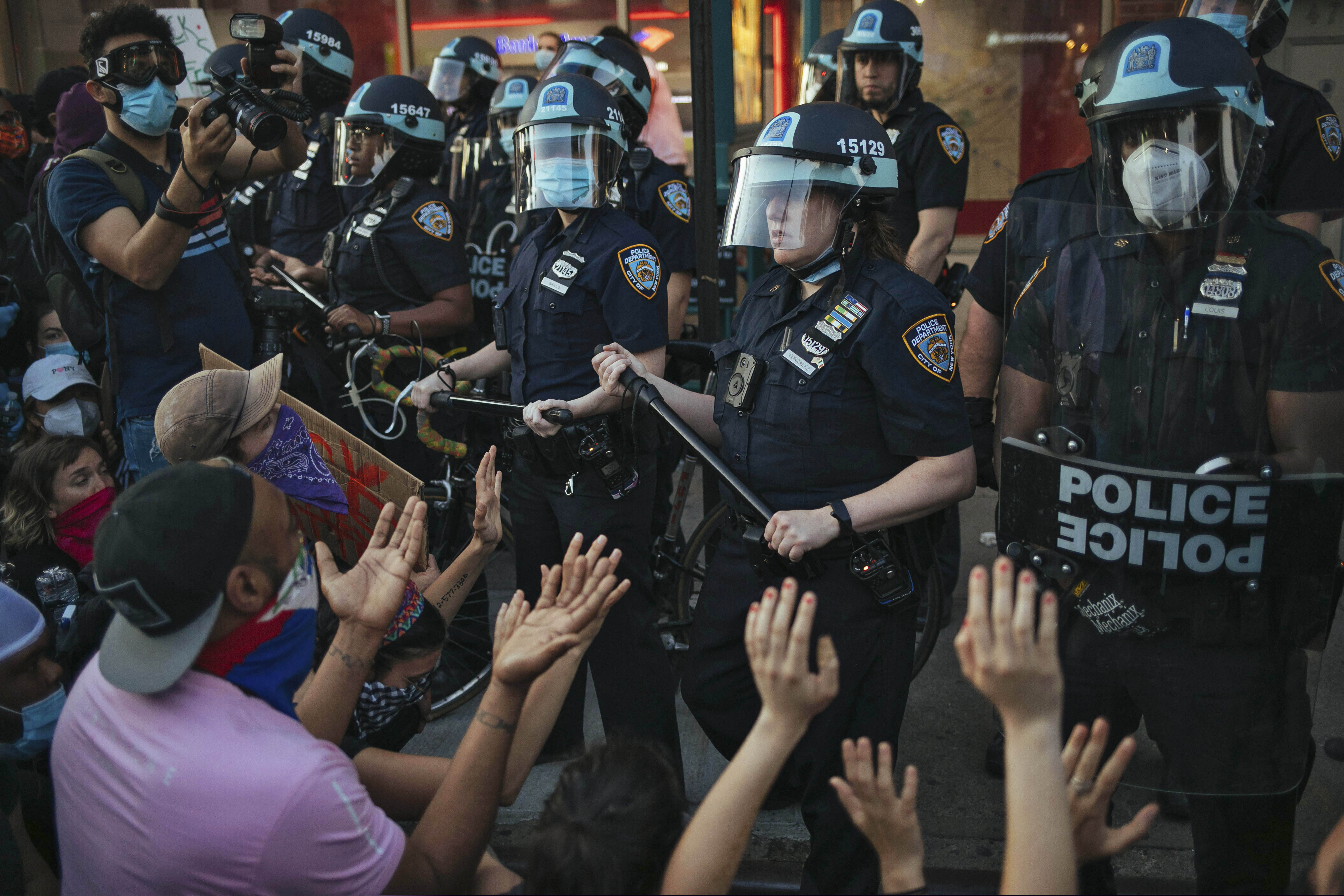 (AP Photo/Kevin Hagen, FIle)
This May 31, 2020, photo shows New York City Police facing off with activists during a protest march in the Bedford-Stuyvesant section of the Brooklyn borough of New York. New York’s attorney general sued the New York Police Department on Thursday, Jan. 14, 2021, alleging the rough treatment of protesters last spring in the wake of George Floyd’s killing was part of a longstanding pattern of abuse that stemmed from inadequate training, supervision and discipline.