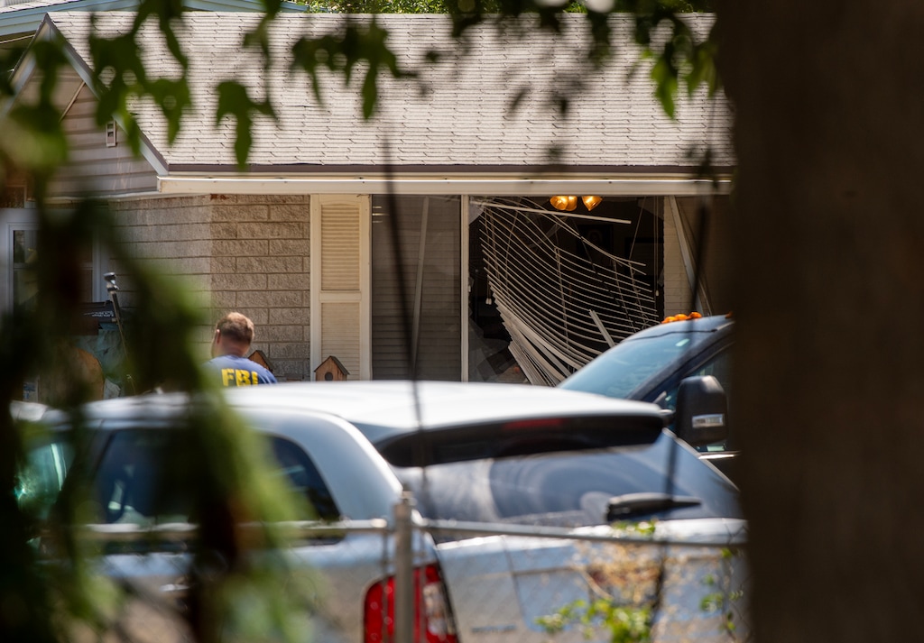 (Chris Samuels | The Salt Lake Tribune) Authorities investigate a home in Provo on Wednesday, Aug. 9, 2023. The FBI shot and killed a man who authorities say made threats to President Joe Biden ahead of his visit to Utah on Wednesday.