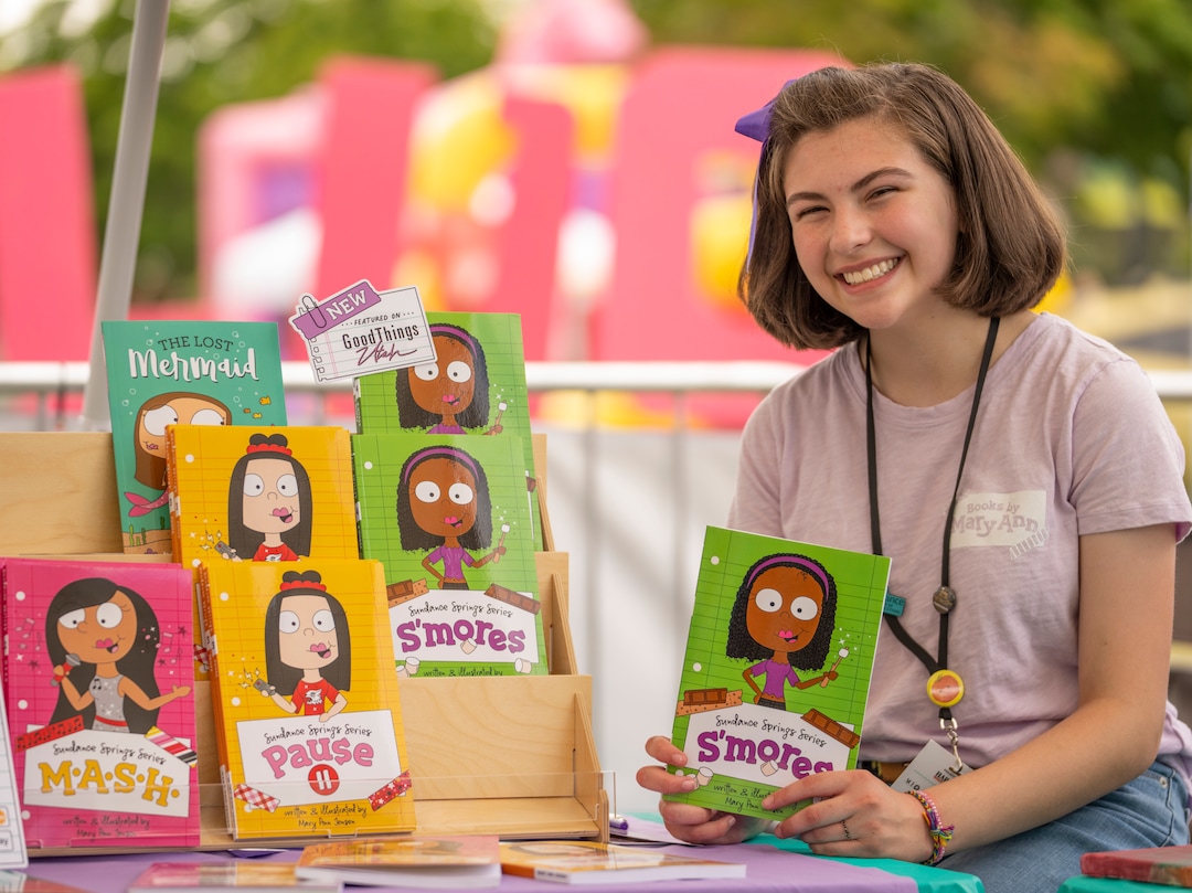 (Rick Egan | The Salt Lake Tribune) Mary Ann Jensen 14, with the 5 books,  she has written, at 14th annual Craft Lake City DIY FEST, at the Fair Park, Aug. 13, 2022. 