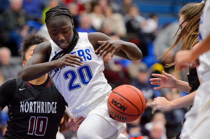 (Trent Nelson | The Salt Lake Tribune)  Northridge's Kendell Petersen (12) knocks the ball from Bingham's Shanyce Makuei (20) as Bingham faces Northridge in the 6A High School Girls' Basketball Tournament at SLCC in Taylorsville, Thursday Feb. 22, 2018.