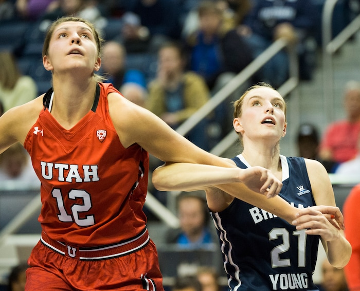 Rick Egan  |  The Salt Lake Tribune

Utah Utes forward Emily Potter (12) and Brigham Young Cougars guard Lexi Eaton Rydalch (21) battle for position, in basketball action, BYU vs. Utah, in the Marriott Center, Saturday, December 12, 2015.