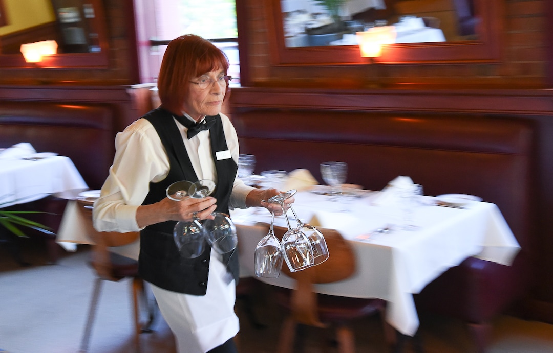 (Francisco Kjolseth  |  The Salt Lake Tribune)  Flo Blank, who has been a restaurant server for nearly 40 years, previously working in NYC, and at Salt Lake City's La Parisian and Al Forno's, works her regular shift at The Paris Restaurant at 15th and 15th in Salt Lake City recently as she keeps a quick pace and can be heard regularly saying "ooh, la, la and forget about it."
